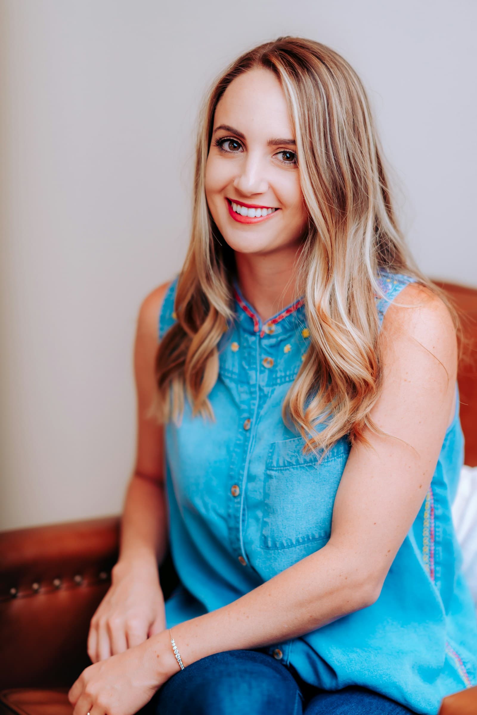 Smiling woman in a denim top